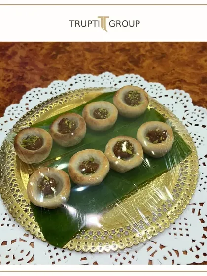 A plate of our delicate, handcrafted Indian sweets, ready for a celebration.
