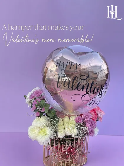 Make your Valentine's more memorable with this stunning metal basket hamper. It's filled with fresh flowers and a rose gold "Happy Valentine's Day" balloon for a touch of modern romance.