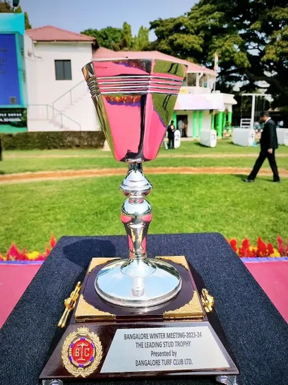 The Leading Stud Cup, a classic silver trophy with a square base.