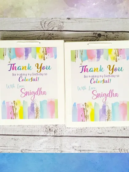 The personalized paper bags for the art party thank guests for making the birthday so colorful, with a lovely watercolor design.