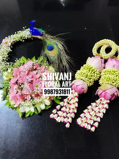 Another beautiful baby shower set featuring lotus bud kalire and a matching floral purse with a peacock design.