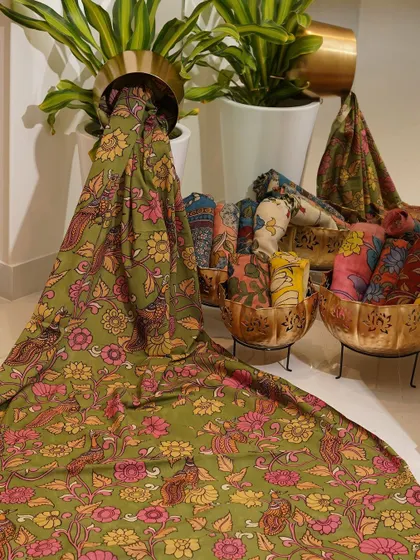 This is a glimpse into my Kalamkari Edition, featuring a wide array of hand-painted dupattas and fabrics from the Indralokam series. Each piece is a unique story, available for you to customize into your dream outfit.