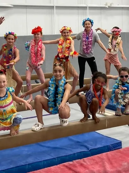Who says you can't have a luau on a balance beam? During our team spirit weeks, we get creative with fun themes that bring an extra layer of excitement to our gym activities.