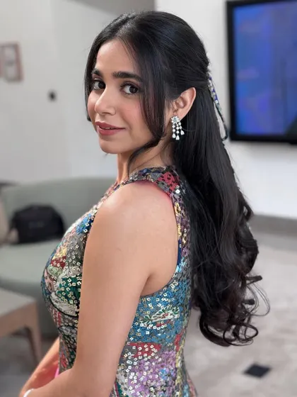 A pretty and youthful half-up style with a matching bow.