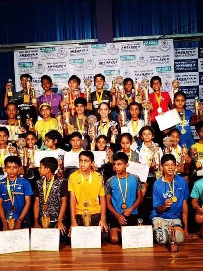 A moment of pride for our academy. This group photo shows our young champions after a successful tournament, holding their well-deserved trophies and medals, representing the collective success of our training programs.