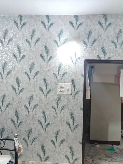 A bedroom with a peacock feather wallpaper, adding a touch of exotic elegance and color.