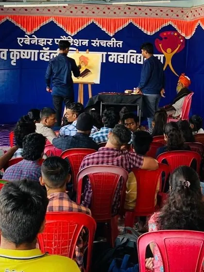 A wider view of the workshop at Nav Krishna Valley College, showing the model and the artwork taking shape on the easel. These events are a fantastic opportunity for aspiring artists to see professional techniques firsthand.