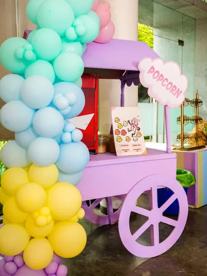 A pastel purple popcorn cart that can be coordinated with any party's color scheme, shown here at a Hello Kitty event.