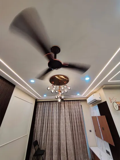 A favorite memory often hides in the corners of a beautifully designed space. This image captures the mood of our work, focusing on details like lighting and curtains.