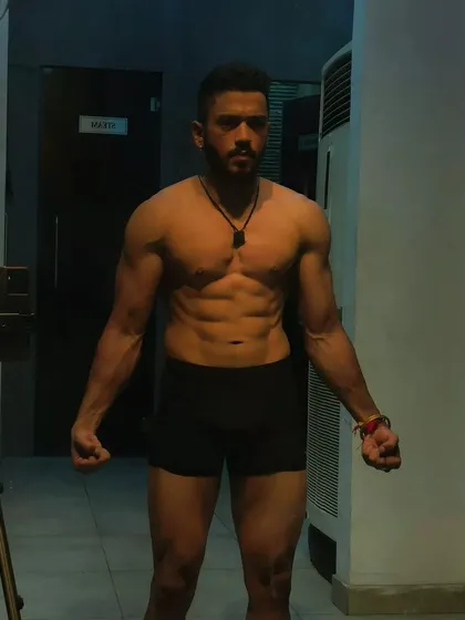A powerful front pose. This is the look of someone who is in control of their body and their life.