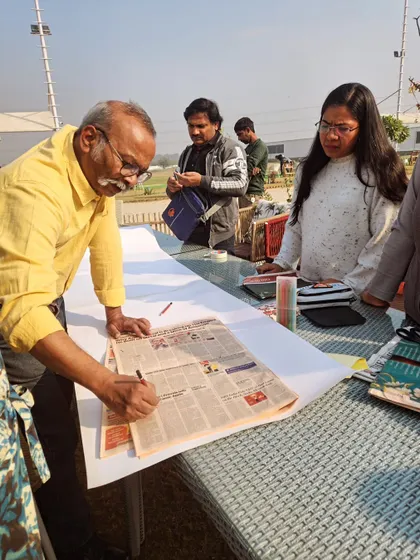 An artist at work, sketching and planning his piece during a workshop held at our venue.