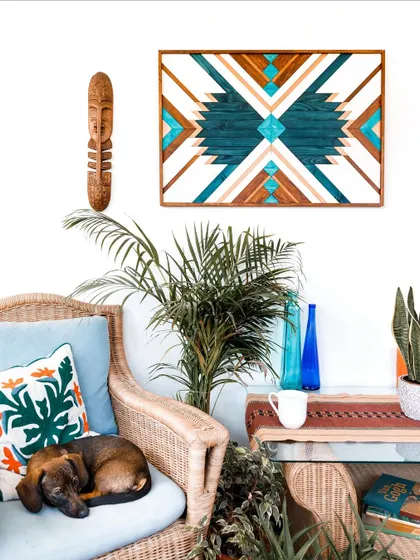 Our Geometric Blue Wood Art brings a vibrant, bohemian energy to this cozy corner. The Aztec-inspired patterns and rich teal and wood tones create a cheerful and stylish piece that perfectly suits eclectic and modern home decor.