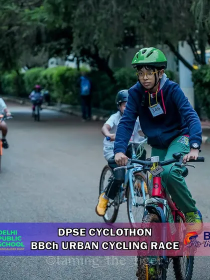 A young rider navigates a paved path during the urban cyclothon. Our courses often feature mixed terrain to provide a dynamic and fun challenge.