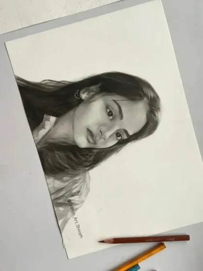 This A4 realistic sketch was an order from Lucknow. The final piece is laid out with some of my pencils to show the tools of the trade.