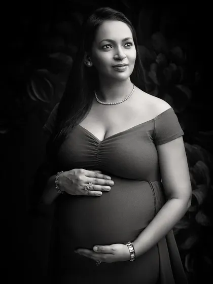 A glamorous black and white portrait that exudes elegance. The off-shoulder gown, diamond necklace, and expert lighting create a look of classic Hollywood sophistication.