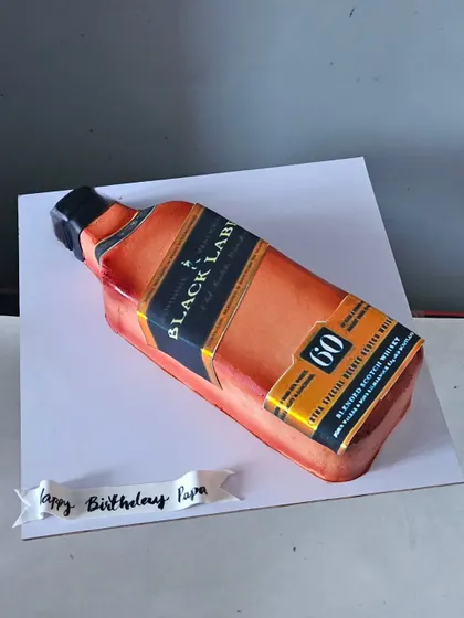 Is it a bottle or a cake? This is one of my proudest achievements in whipped cream artistry. I meticulously airbrushed the colors and details to create this hyper-realistic Black Label bottle cake, proving that even the most complex shapes are possible with cream.