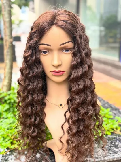 Our natural curly, dark brown wig offers amazing volume and length. It's glamorous yet comfortable enough for daily use.