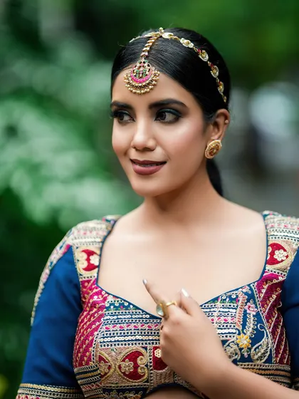 A candid, smiling portrait that captures a moment of genuine expression, making the fashion feel more approachable and real.