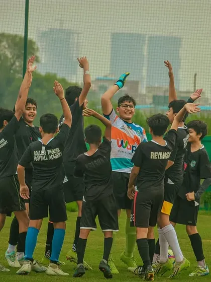 A team huddle to celebrate a goal, showing the unity and spirit I foster.