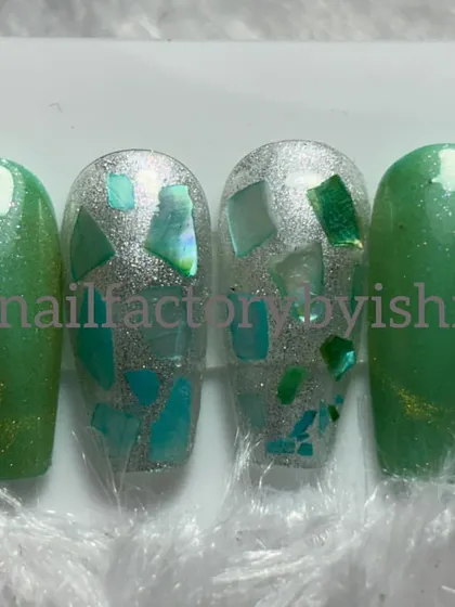 A green and silver press-on set with a shattered glass effect. We cover techniques like this in my advanced courses.
