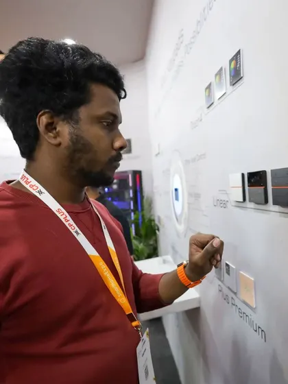 A visitor gets a hands-on experience with our SyncPro keypads, testing out the different models from our Plus and Plus Premium series on the display wall at our expo booth.