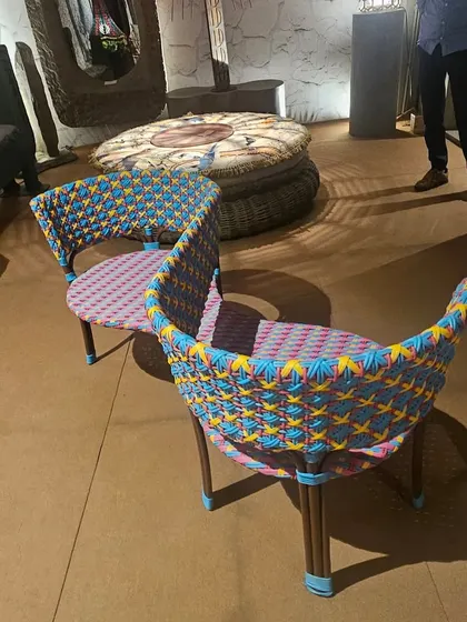 One of my top picks from our new collection. These vibrant, multi-colored woven chairs add a playful and artistic touch to any outdoor setting.