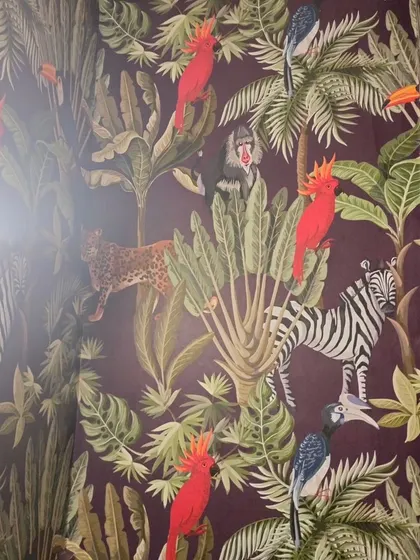 A corner installation of the dark jungle wallpaper.
