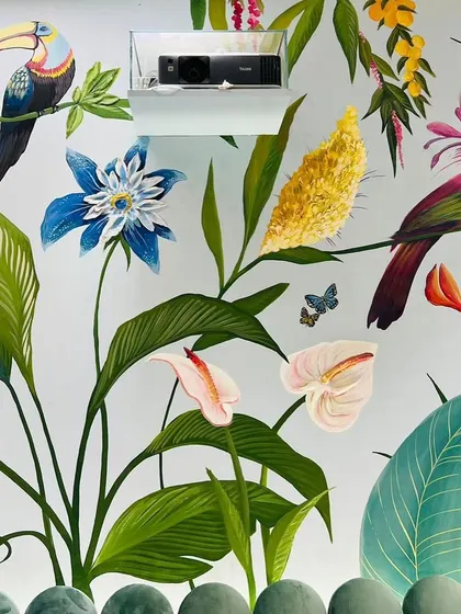 This shot shows more of the intricate details in the tropical mural, from the delicate butterflies to the different types of birds nestled among the leaves. It's a piece that invites you to keep discovering new things.