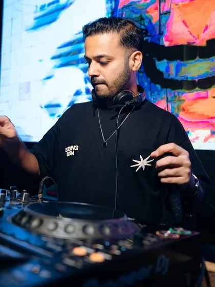 In my element at SOHO Goa, headphones on, selecting the next track to keep the party going.