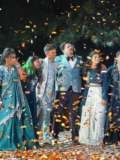 The grand finale of a sangeet performance, with the whole family coming together on stage under a shower of confetti. We love creating these big, inclusive moments that become a core memory of the wedding.
