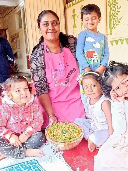Making a healthy and delicious chickpea salad, where children practiced chopping vegetables and mixing ingredients to create a nutritious meal.