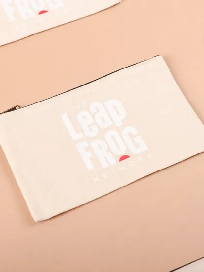 A branded canvas pouch, perfect for organizing small essentials. This was part of a larger onboarding kit we created for The Leapfrog Network.