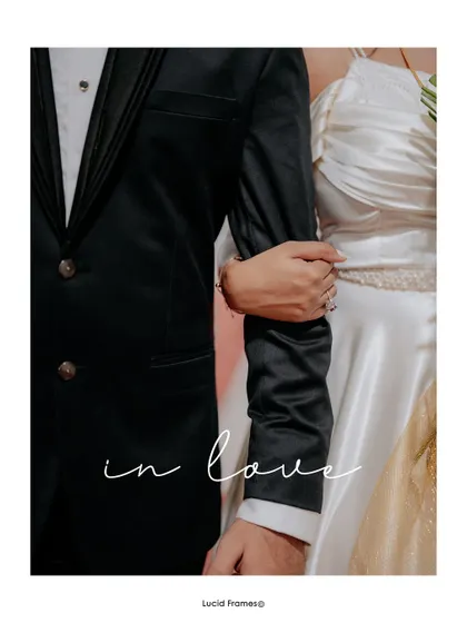 "In love." A simple, elegant shot focusing on the couple's connection as they stand arm-in-arm.