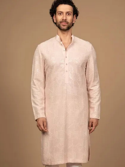 The full silhouette of the pink embroidered kurta. Its clean lines and sophisticated color make it a standout piece that is both elegant and contemporary.