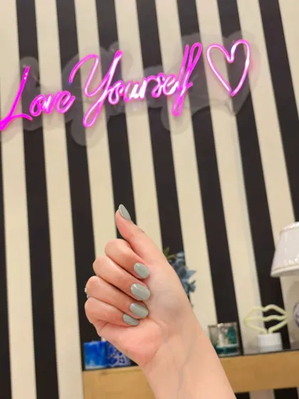 Sage green holochrome nails, a trendy and subtle way to wear the chrome effect.