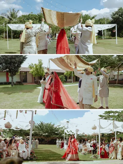 The bride's stunning entrance at her outdoor wedding, walking down an aisle lined with guests towards her happily ever after.