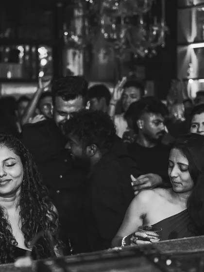 A black and white shot of the crowd feeling the music. I love capturing these candid moments of people enjoying the vibe.