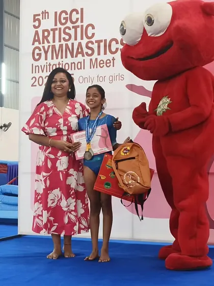 A gymnast receives her award at the 5th IGCI Artistic Gymnastics Invitational Meet, an event we were proud to host.