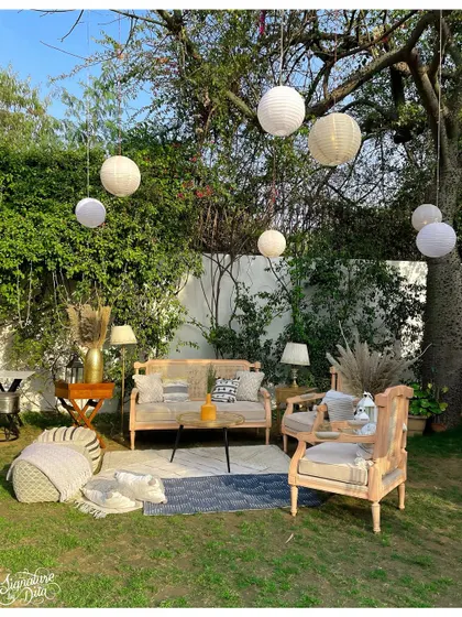 A duplicate of image 1, this bright, sunny shot showcases the inviting quality of the outdoor lounge setup, perfect for a daytime corporate retreat or social gathering.