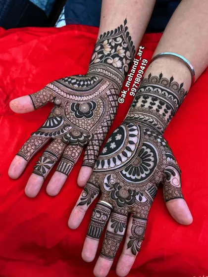 A dense and dark bridal design perfect for Teej or a wedding. The contrast between the dark henna and the skin is striking.