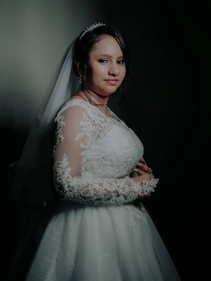 A moody and beautiful portrait of the bride in her white gown, her gentle expression creating a timeless image.