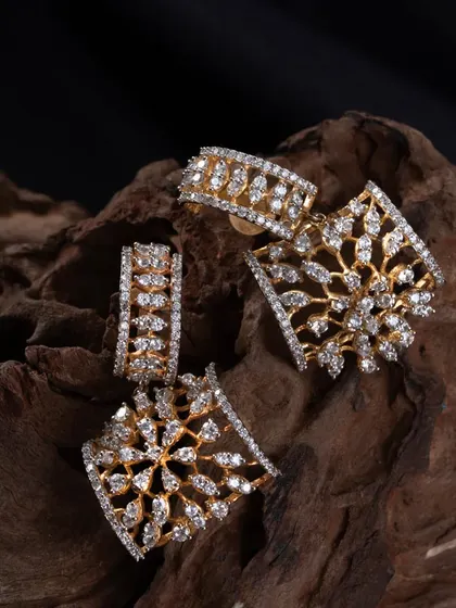A modern earring set with a geometric, snowflake-like design crafted from American Diamonds. This set includes matching drop earrings and studs for versatile styling.