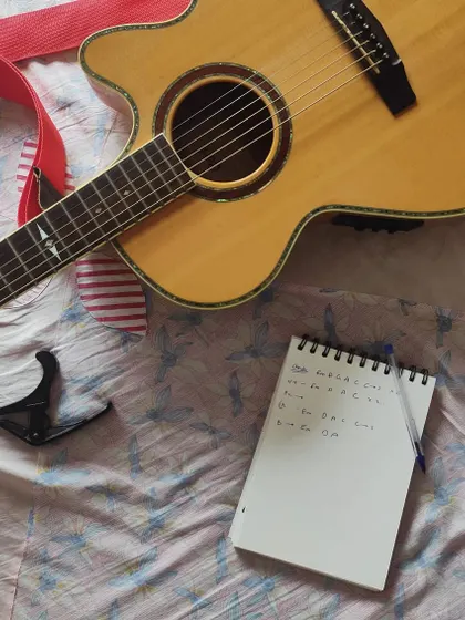 Every song starts here, with a simple notebook and a guitar. This is where I jot down the chords, lyrics, and feelings you share with me, laying the foundation for a truly personalized anniversary or birthday song.