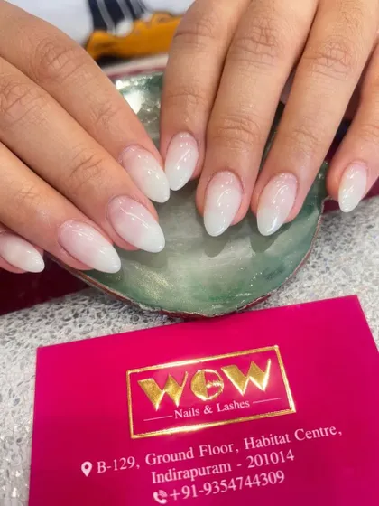 A classic and elegant baby boomer or ombré effect on almond-shaped extensions. The soft, milky-white gradient is timeless and perfect for any occasion.