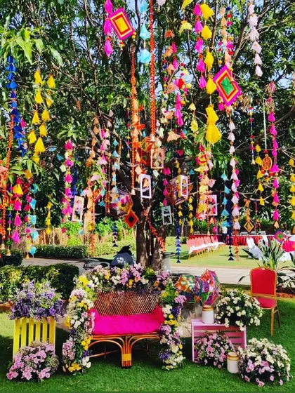 A magical Mehendi tree. I decorated this tree with colorful tassels, photos, and flowers, turning it into a beautiful and personal centerpiece for the event.