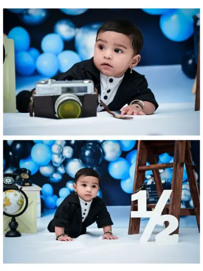 A two-photo set from a half-birthday session, capturing the baby boy interacting with a vintage camera prop and crawling past the '1/2' sign.