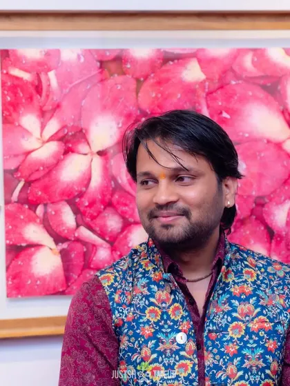 A candid moment at the exhibition, standing before a beautiful floral artwork. I find inspiration everywhere.