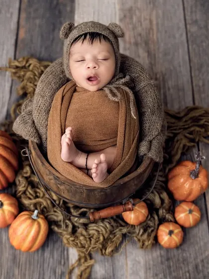 Our little pumpkin is giving a big yawn! These candid moments are just as precious as the posed ones.