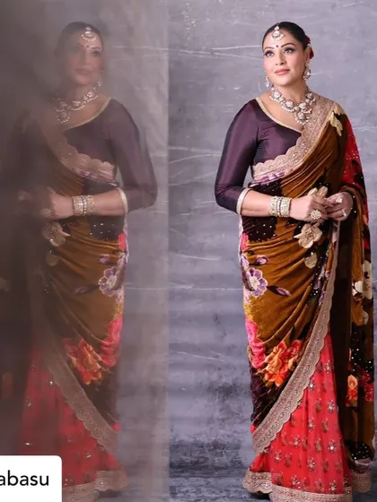 A full-length view of Bipasha Basu's gorgeous floral saree, captured with a creative reflection to add artistic depth.