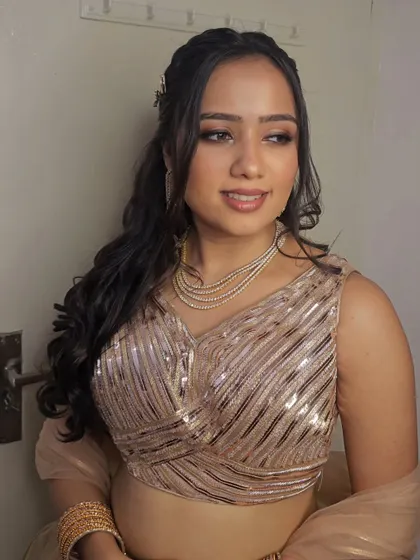 For this pre-wedding function, Anjali requested a "zero blush" look. I focused on creating a sculpted, bronzed look with a neutral lip.